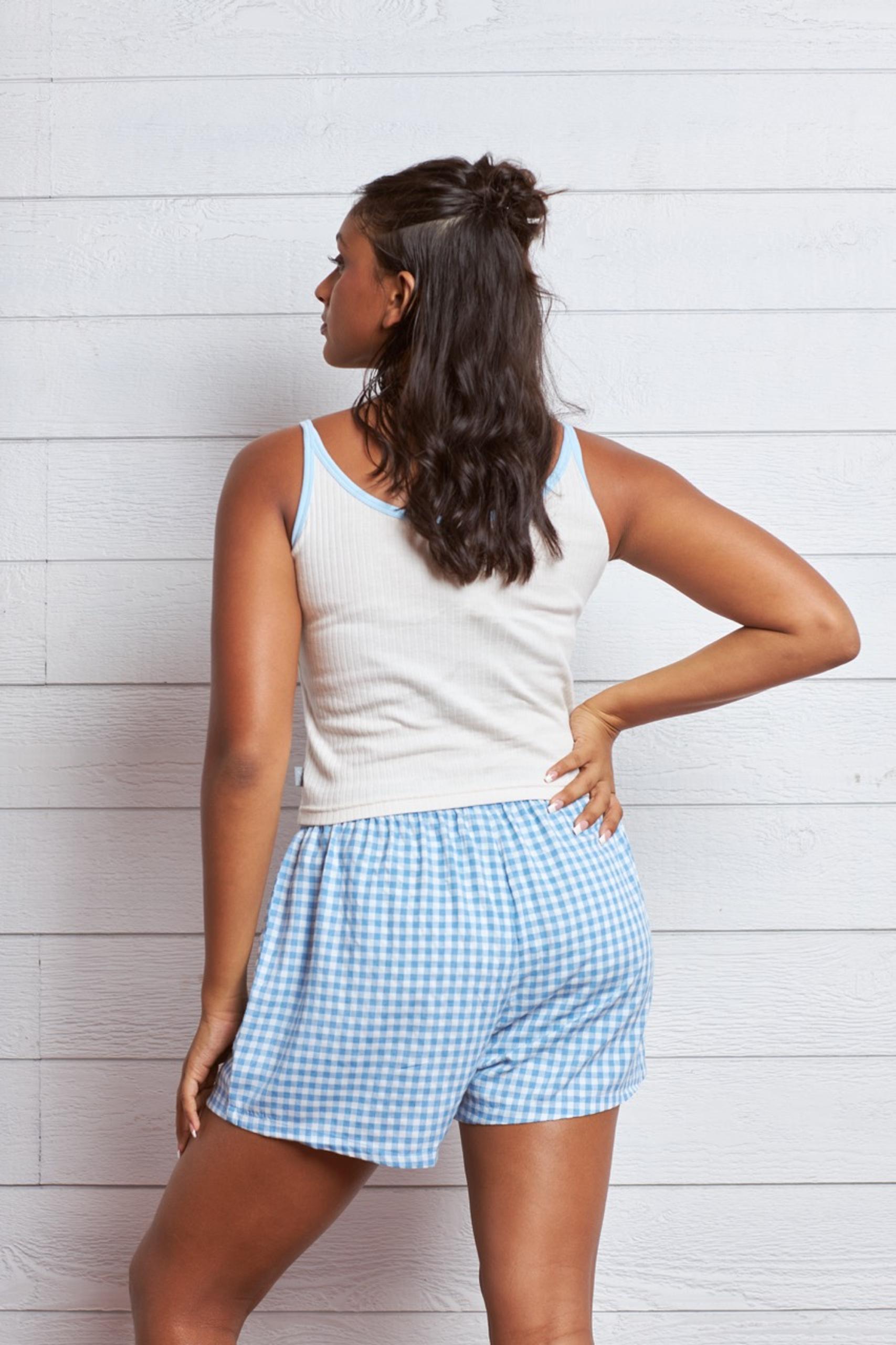 Teen Girl Wearing White Ribbed Crop Top with Blue Binding in Colombo, Sri Lanka