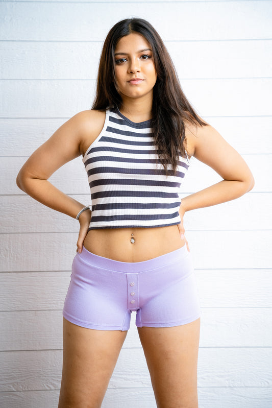 Our comfiest mini shorts are made to lounge. It has a non-functional button detail in the middle for some extra cuteness. Made with 100% cotton rib. It’s a fit mini boxer short that has a insert elasticated waist band.