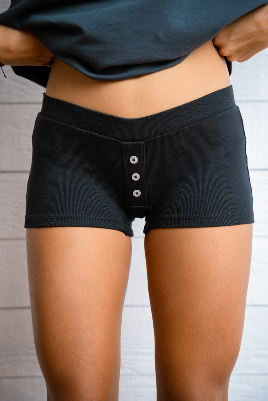 Our comfiest mini shorts are made to lounge. It has a non-functional button detail in the middle for some extra cuteness. Made with 100% cotton rib. It’s a fit mini boxer short that has a insert elasticated waist band.